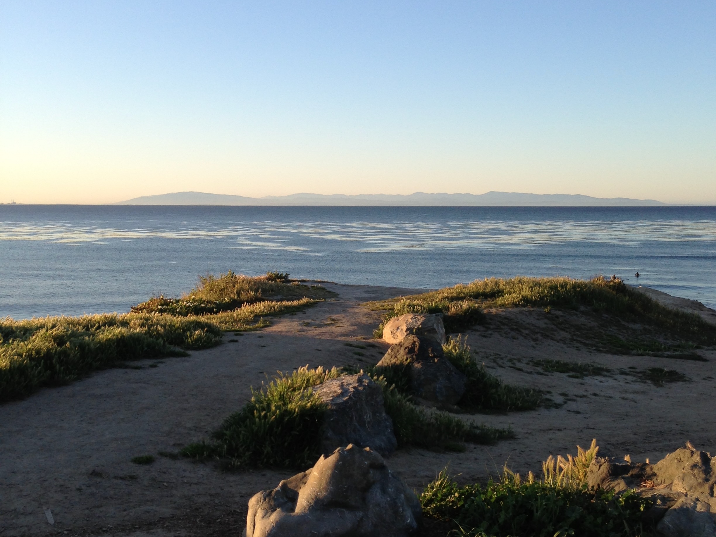 Pleasure Point Beach, California – Photo by Ricky LaPraim View of Pleasure Point Beach, California, with waves gently meeting the shoreline