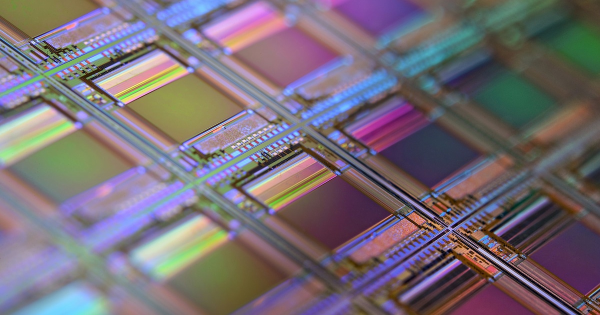 Close-up of a silicon microchip wafer used in modern CPU fabrication.