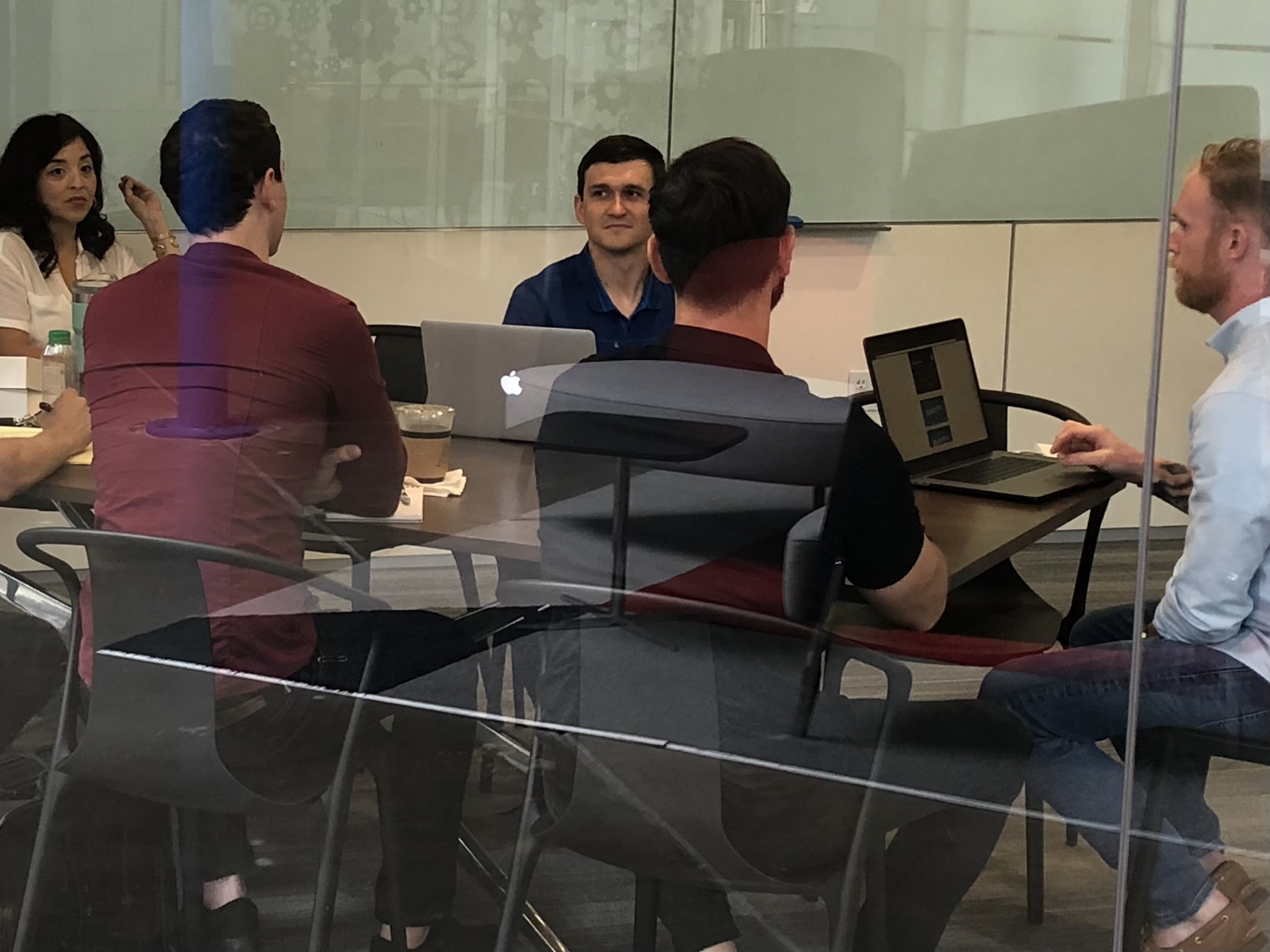 Ricky Lee LaPraim leading a meeting with developers for the rewards platform mobile app, which later evolved into RepeatMD